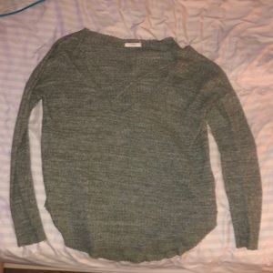 grey, cross chested sweater.
